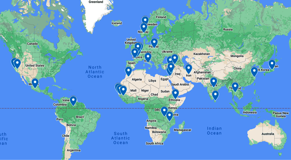 A world map highlighting various locations with blue markers. The markers are spread across multiple continents including North America, South America, Europe, Africa, and Asia. These markers likely indicate significant points of interest, such as offices, events